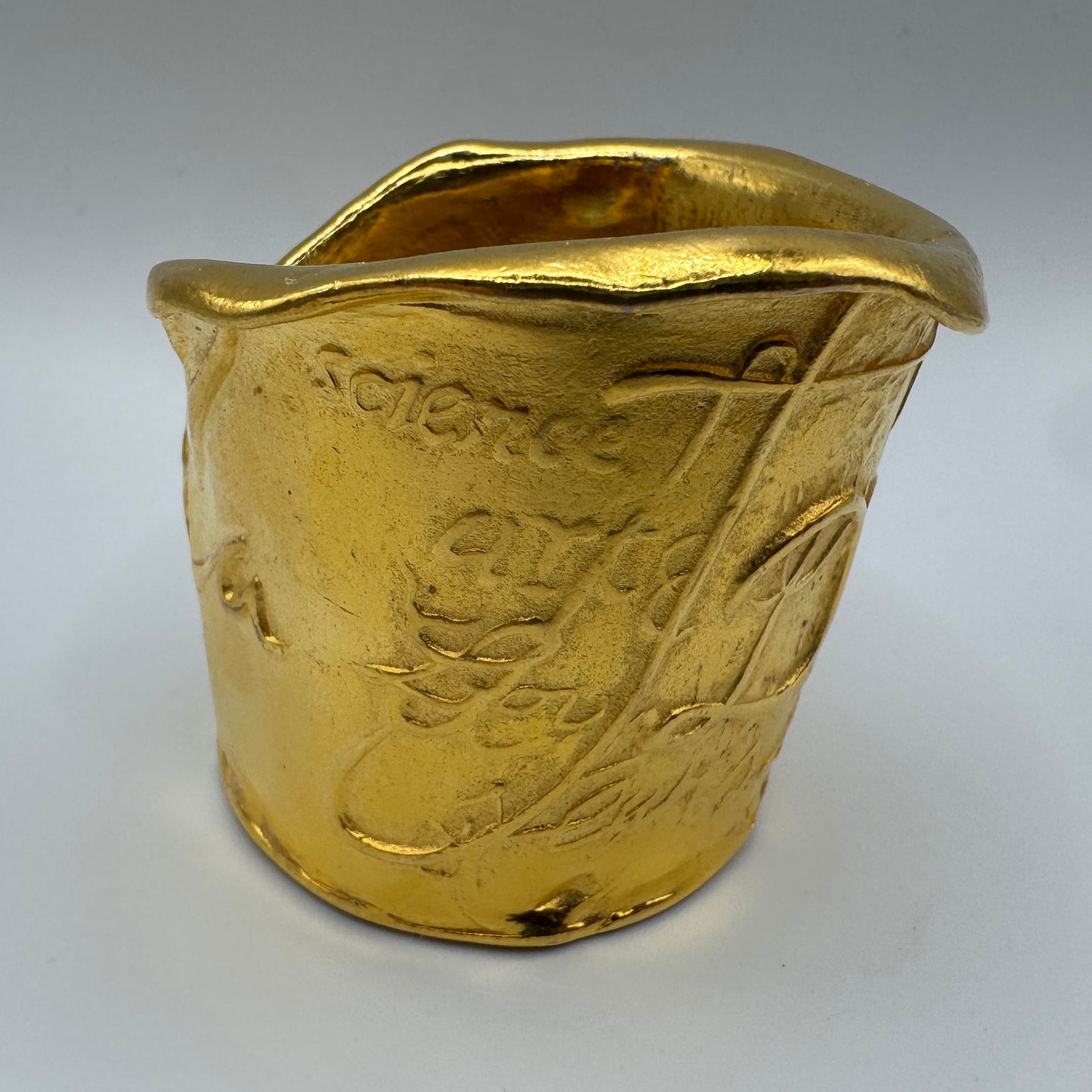 Petit pot artistique Donna Karan - métal doré