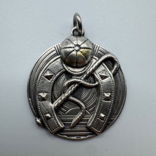Pendentif ancien porte bonheur « fer à cheval » en métal argenté