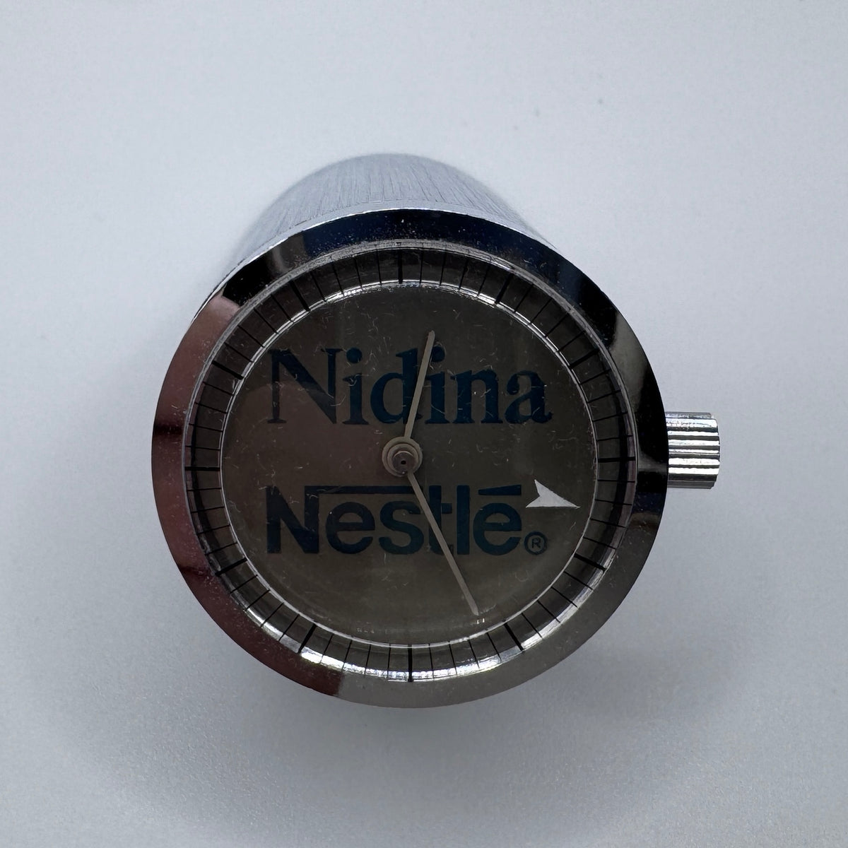 Rare montre réveil ancien publicitaire « Neslé - Nidina » vers 1960