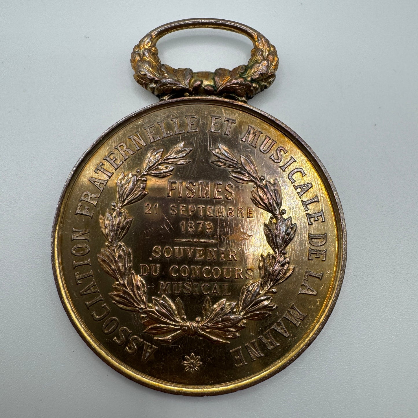 Médaille ancienne en cuivre « concours de musique de FISMES 1879 »