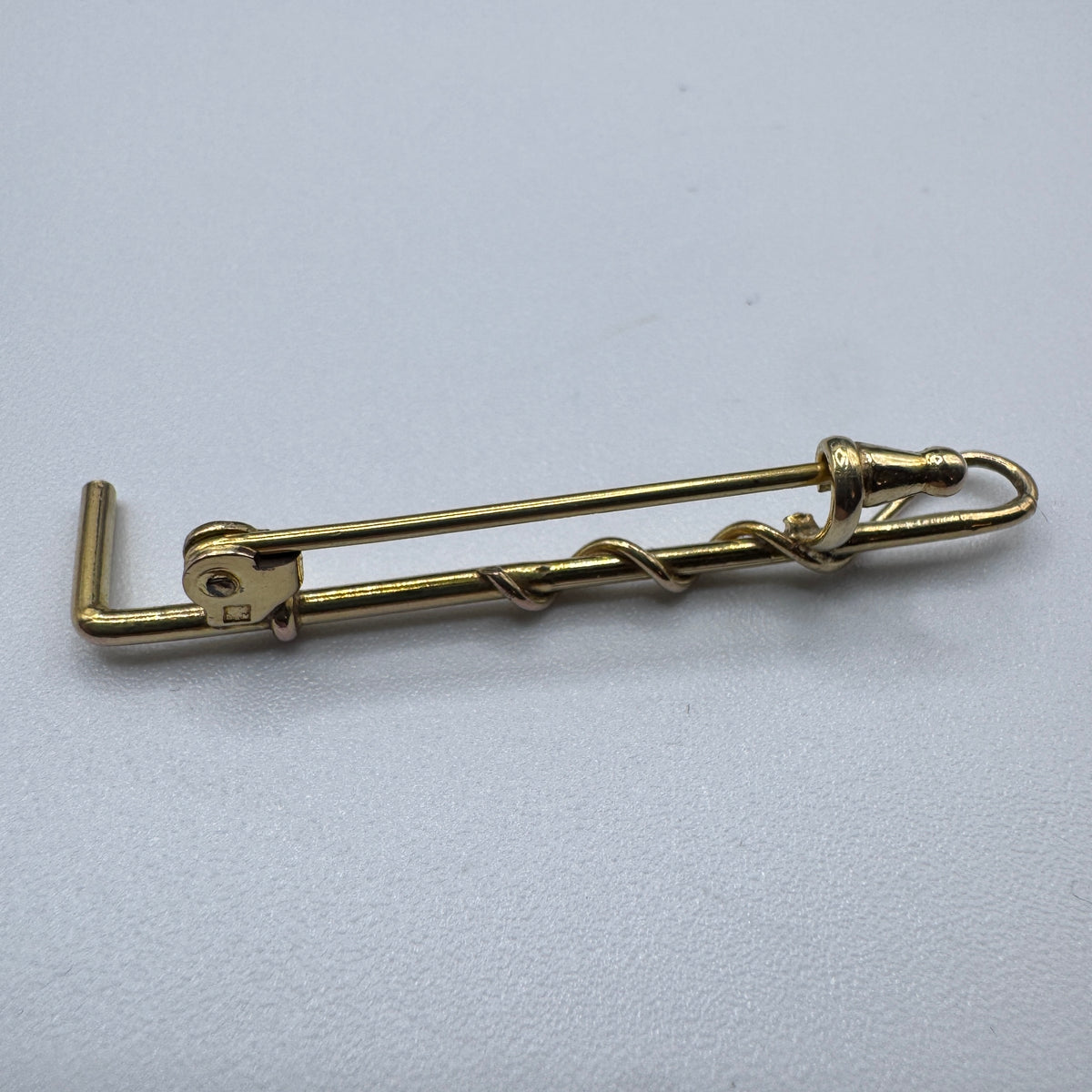 Broche ancienne « cravache » en plaqué or